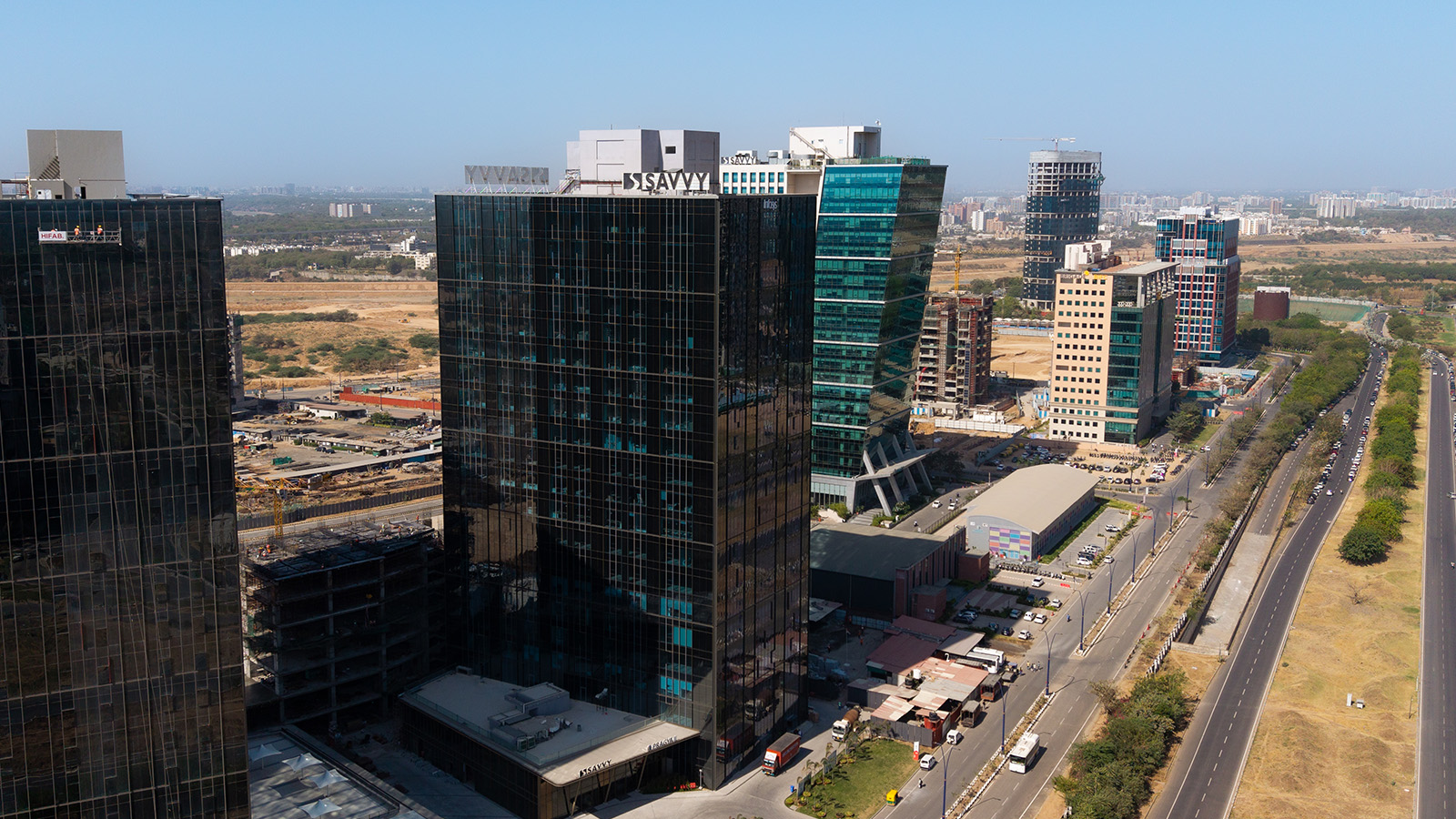 High-rise business district in India featuring glass office towers.
