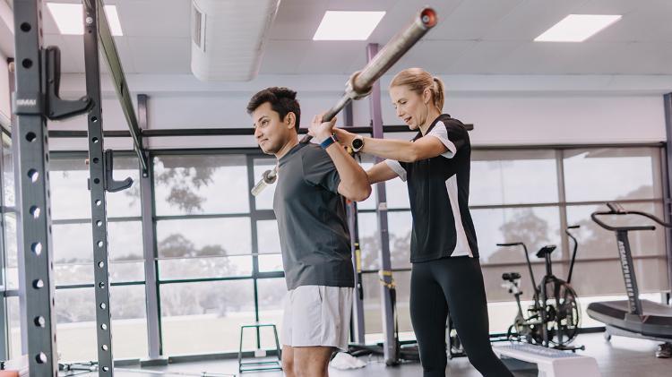 Fitness trainer Kelly McMullan with client